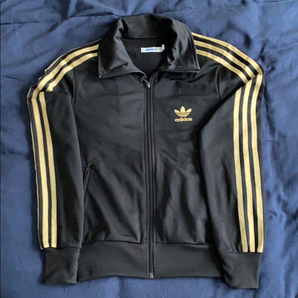 Adidas track jacket. Black and gold.